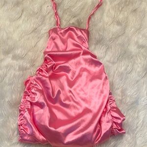 Satin material, adjustable back straps, ruched back.